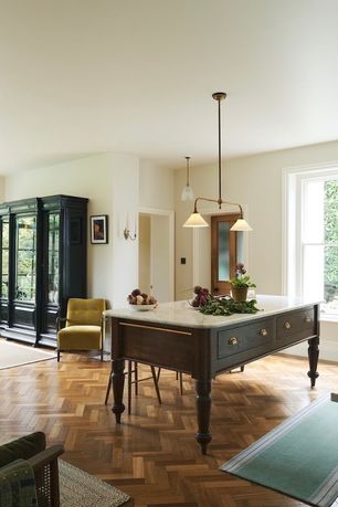 A large dining and lounge area with a movable oak table as the centrepiece