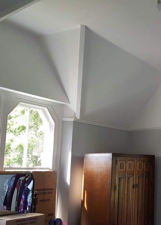 A spare room that has been fully decorated with lots of ceiling angles